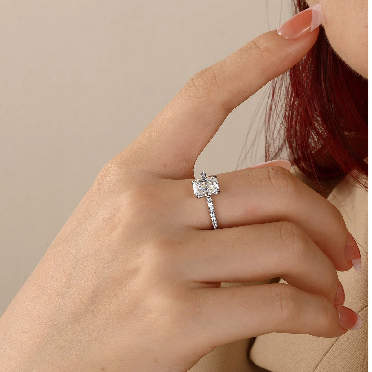 Radiant solitaire ring on hand